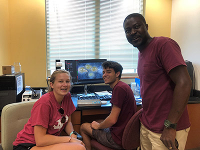 Frimpong with grad and undergrad students in his lab studying physiological responses and development of eggs collected from active Bluehead Chub nests.