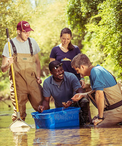 Frimpong with graduate students studying native freshwater fish communities of Virginia.