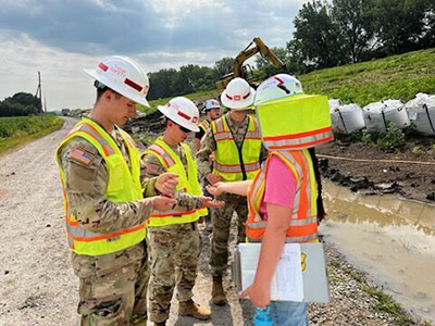 Austin Grant with colleagues on a job site.