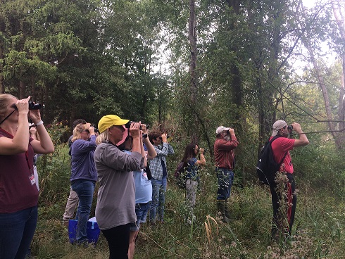 Group looking through binoculars