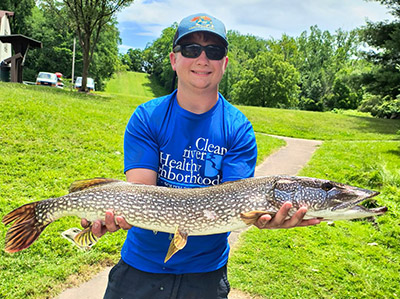 Noah Haas holds a large Northern Pike, which was caught during a boat survey