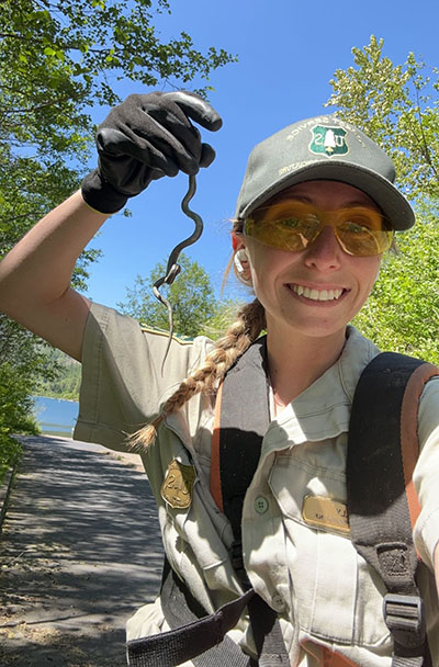 Lillian Hannon holds a garter snake