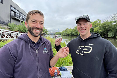 Austin Happel and Luke McGill with acoustic sensors which will be used to track fish in the Chicago River