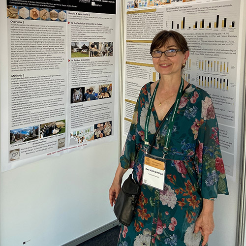 Dr. Eva Haviarova receives her SWST fellow certificate in Korea; Haviarova stands with research posters about her work at the SWST conference.