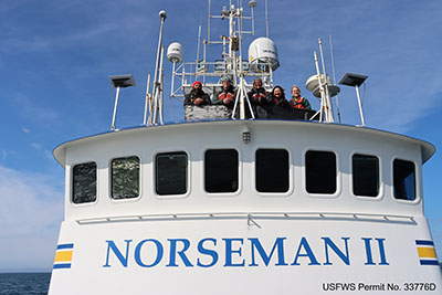 Joshua Carpenter (USGS volunteer), William Beatty (USGS research wildlife biologist), Caroline Cummings (USGS volunteer), Amanda Herbert (USGS biological science technician), and Ami Everett (USGS biological science technician) conducting Pacific walrus age structure surveys from the RV Norseman II.  