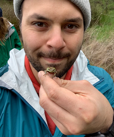 Hernandez-Gomez holding a frog