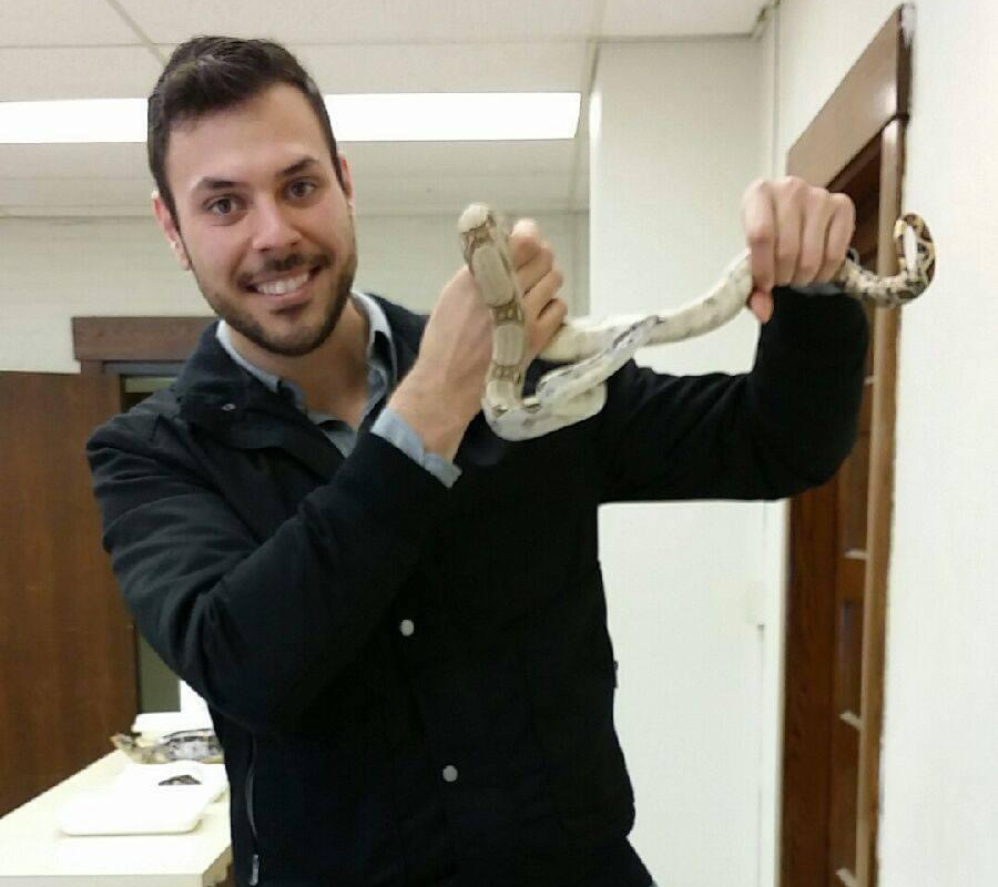 Hernandez-Gomez holding a snake