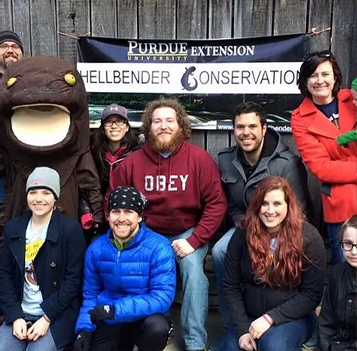 Hernandez-Gomez with hellbender mascot and lab