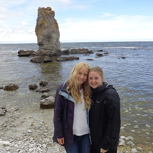 Bella Hilaski looks at the forest in Sweden; Bella and a friend stand with a Rauk, or stone pillar; the Visby church.
