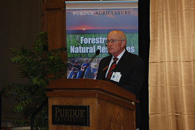 Hoover speaks at a podium, talking about the history of FNR at Purdue at the department's centennial celebration in 2013.
