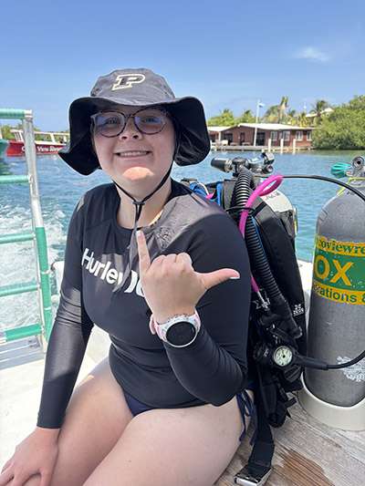 Ava Hoskins poses with her scuba gear on.