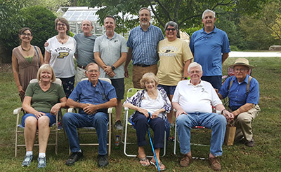 A mini reunion of the Wood Research Lab. Standing: Dr. Eva Haviarova,  Angie Terry, Martin Quanci, Mike Gilley, Jim Bradtmueller, Linda Kirk Brown, Bob Lattanzi. Seated: Vicki and Dan Cassens, Phyllis and Michael Hunt and Dr. Bill Hoover.