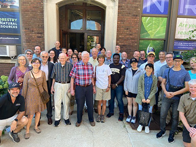Members of the Wood Research Lab past and present are pictured in front of the Forest Products Building at their 2022 reunion.