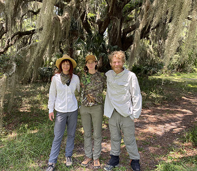 Pouli Sikelianos, Brianne Innusa and Caleb Redick pose for a photo while conducting research on Cannon's Point. 