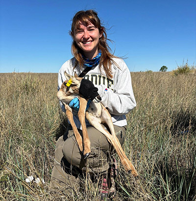 Emma Johnson holds a pronghorn fawn 