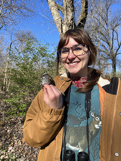 Emma Johnson holds a bird