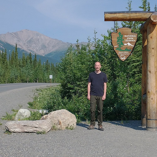 Dr. Ken Kellner at a computer; Kellner teaching; Kellner at Denali National Park.