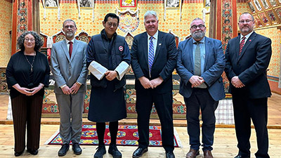 Dr. John Kershaw (second from left) with the King of Bhutan.  