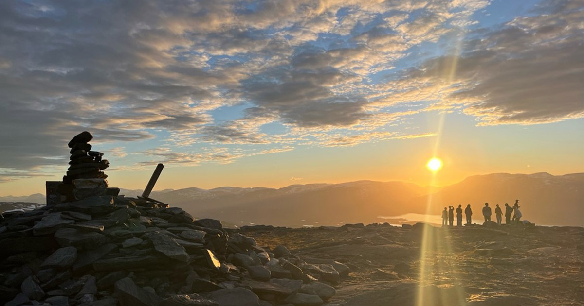 A photo of the midnight sun in Abisko, Sweden.