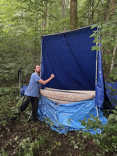 Evan Kinnevan with a harp net trap.