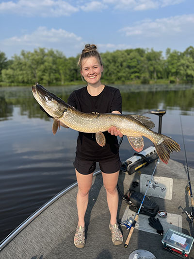 Rachel Kraus holds a northern pike she caught during her internship with University of Wisconsin-Stevens Point (UWSP) Cooperative Fishery Research Unit
