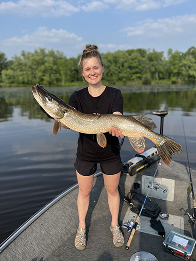 Kraus holds a northern pike caught while fishing on the Wisconsin River