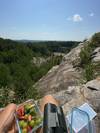 Kraus eating her lunch while hiking at Rib Mountain State Park