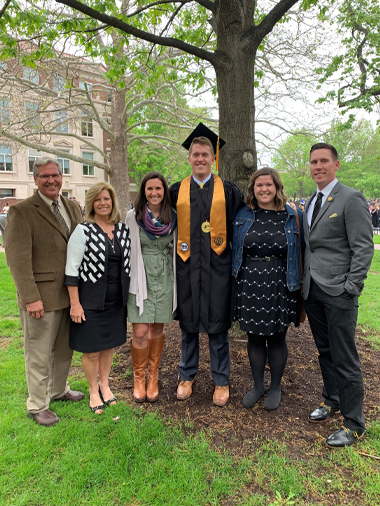 Lucas at graduation with family