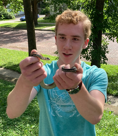 Lucas Wilson holding a small snake