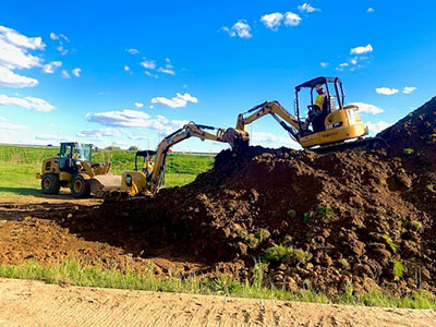 Nathan Lutz works in a Caterpillar on a RES site