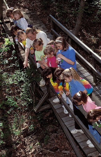 Mary Cutler with children on bridge