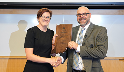 Dr. Emily McCallen is presented the Chase S. Osborn Early Career Award for Wildlife Conservation by Dr. Rod Williams.