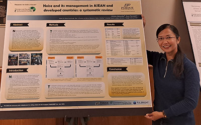 Dr. Christina Mediastika stands with her poster on "Noise and its management in ASEAN and developed countries: a systematic review" at the FNR Poster Competition.