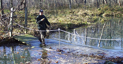 Trent Osmon crosses a bridge under water