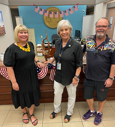 Passenger pigeon pictured with Kelly Delp, Andrew Howe and Atlantic Beach, Florida, mayor Ellen Glasser