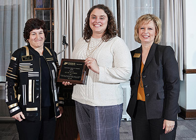 Julie Pluimer receives her Outstanding Service to Students Award