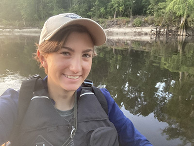 Lydia Pultorak conducting a bird survey from a kayak on the Black River in North Carolina