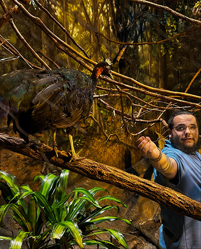 Andrew Reyes feeds Rod, the Congo peafowl.