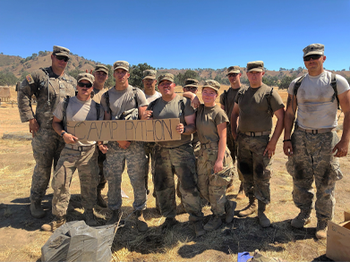 robinson-with-her-army-squad-holding-a-sign