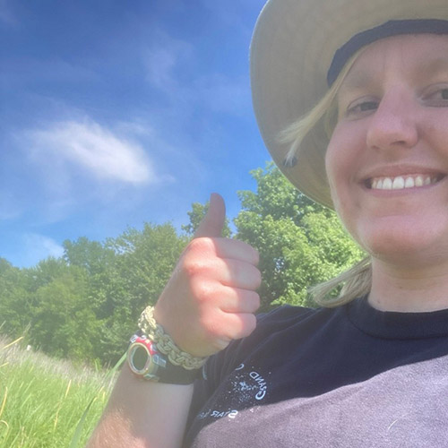 Kline Wetland after five inches of rain; Katie Schouten walking through the Kline Wetland with her employer taking notes on what plant species were present.