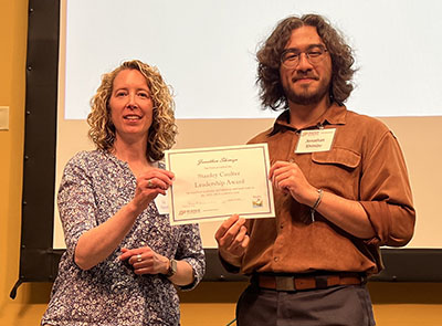 Jonathan Shimizu (right) accepts the Stanley Coulter Leadership Award from associate department head Dr. Elizabeth Flaherty