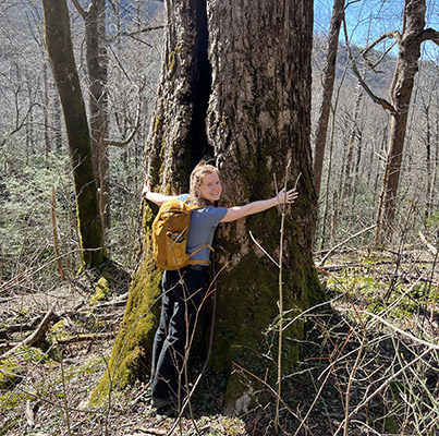 Ruby Sanders hugs a tree in Great Smoky Mountain National Park