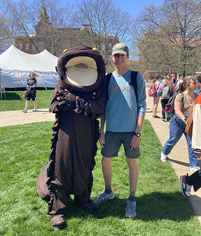 Zane Smoldt poses with Herbie the Hellbender at Ag Week 2023