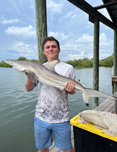 Steven Kelly with a shark at Marine Biology Practicum