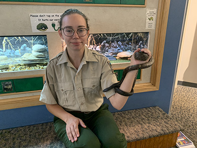 Jade Stuber holds a snake