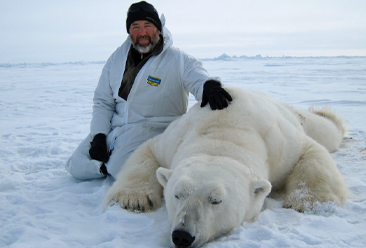 Todd Atwood with a polar bear in Alaska