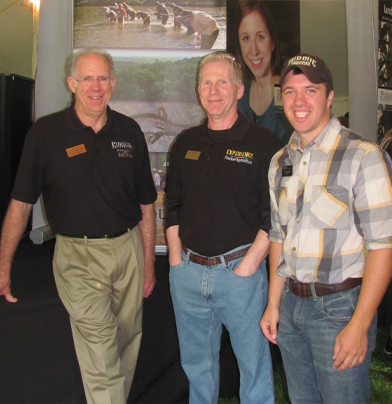 w.l. mills with Rob Swihart in front of a FNR poster