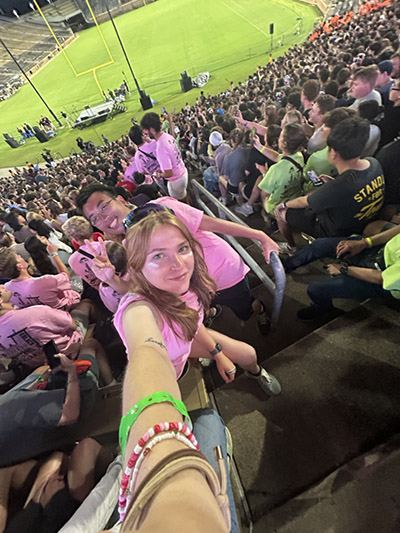 Mallory Wagner takes a selfie with a colleague at a Boiler Gold Rush event at Ross-Ade Stadium