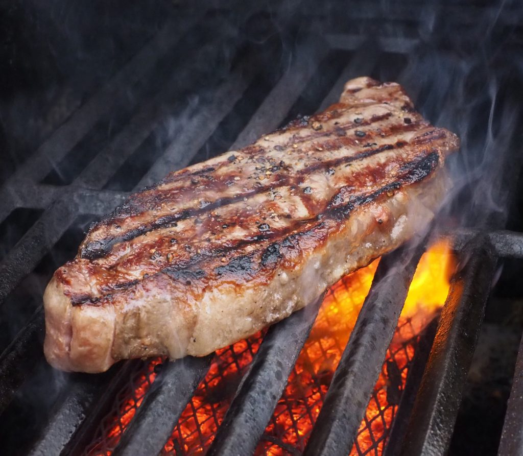 Image of a steak on the grill