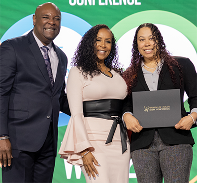 Lawson receives from Women of Color STEM award from Kendall Harris, senior director of equity advancement at the YMCA of the Triangle, and Angela Stribling, radio host (WHURfm) and host and producer of nationwide awareness campaigns such as "Celebrating Black History Vignettes."